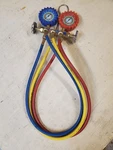 Used Sealed Uniweld 134A Refrigerant 3-VALVE 3-FOOT Hoses Brass Manifold. Fixed Price $50.00.