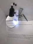 Prohelper Fancii Optics Helping Hands Magnifier Glass. Fixed Price $6.95.