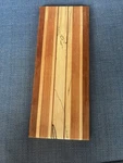 Handcrafted American Walnut & Assorted Hardwood Cutting Board 12" By 5" C1). Fixed Price $16.00.