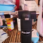 Micro Torch Model Butane Lighter, Powered, Black. Fixed Price $21.99.